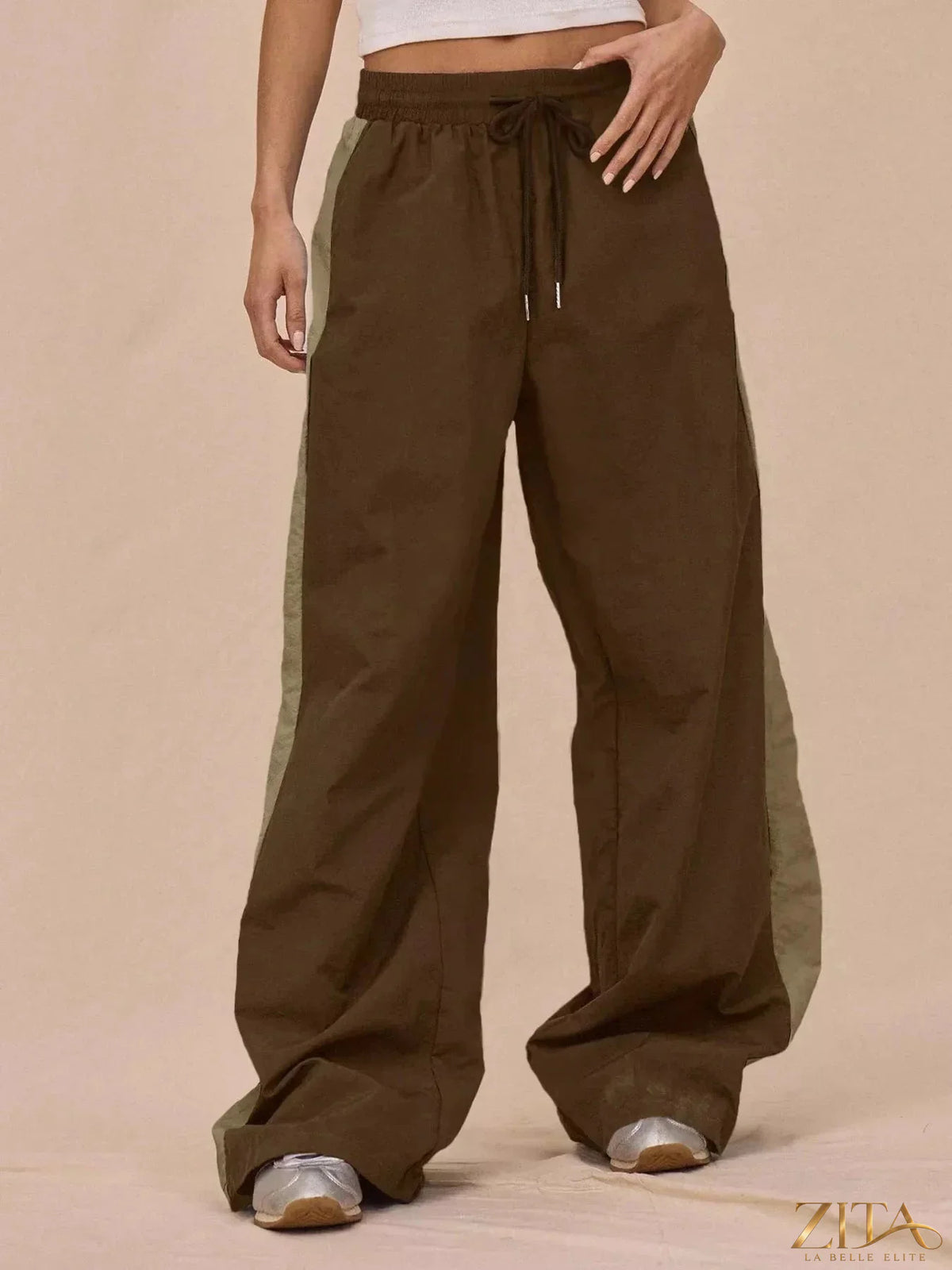 Color-block Zita La Belle Elite tracksuit and wide-leg pants set, featuring vibrant panels and comfortable fit.