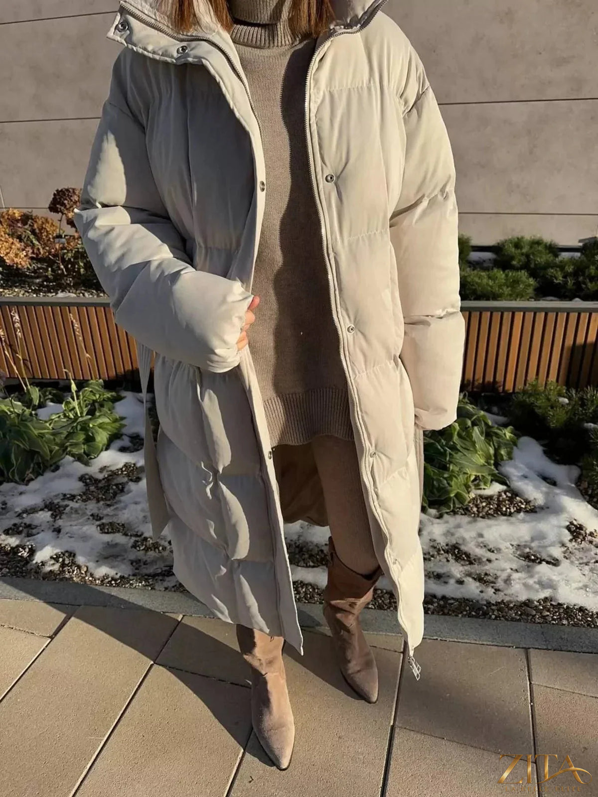 Longline padded winter coat with belt from Zita La Belle Elite, featuring a warm, insulated design and stylish belt detail.