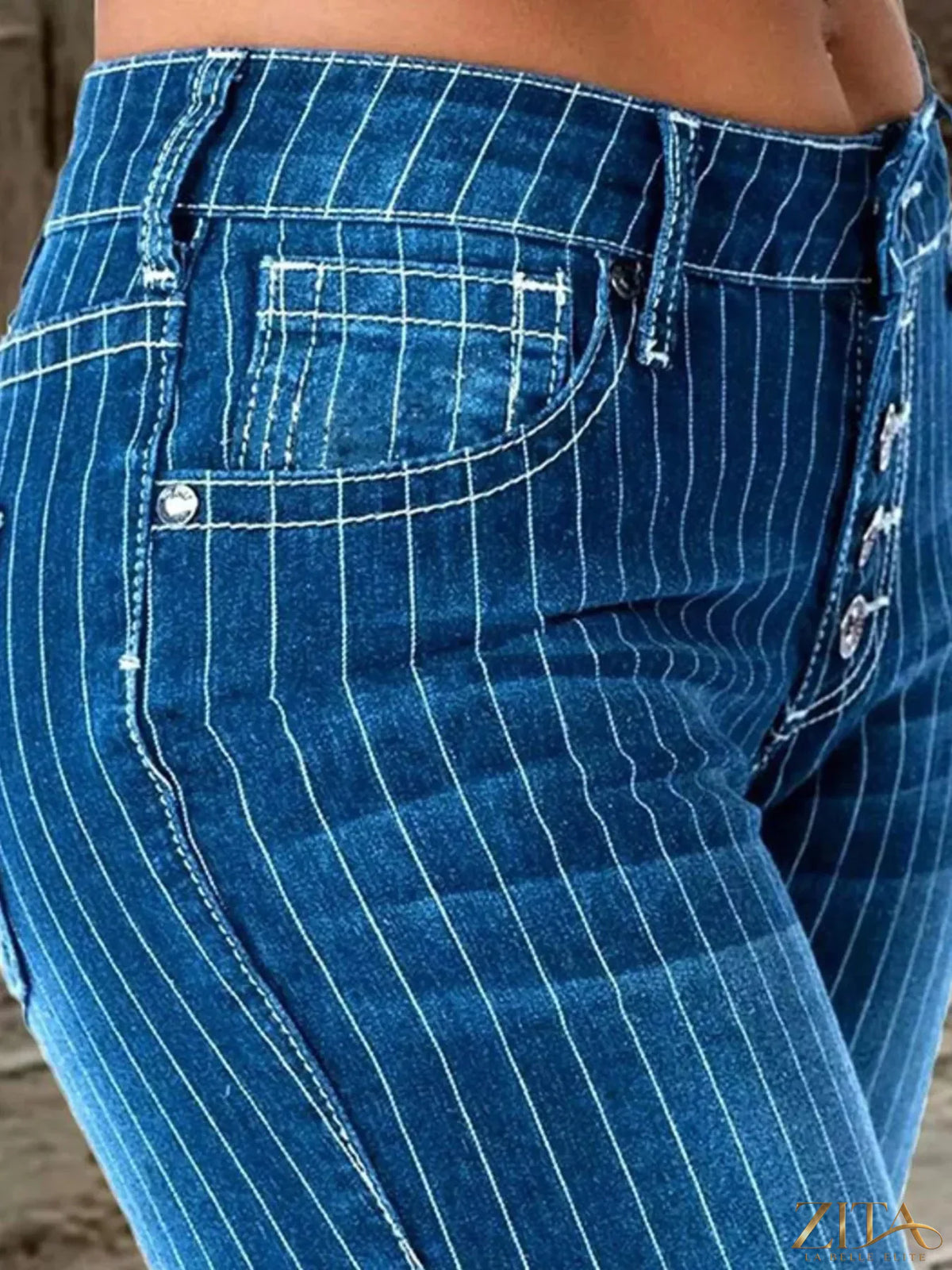 Zita La Belle Elite striped button fly flare jeans with high waist and retro-inspired vertical stripes, full-length on a model.