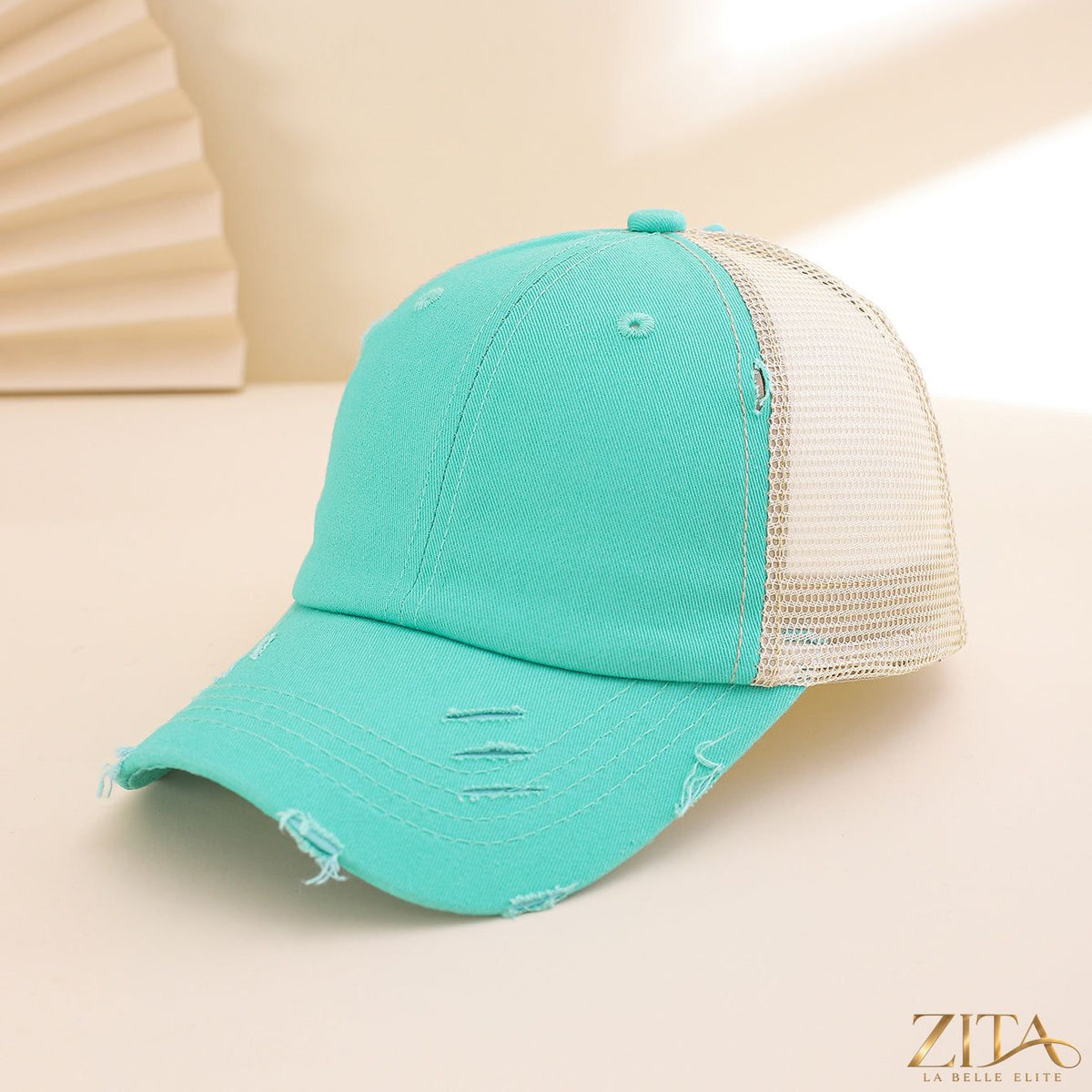 Distressed washed mesh baseball cap by Zita La Belle Elite, casual hat with a rugged, vintage style and breathable mesh panels.