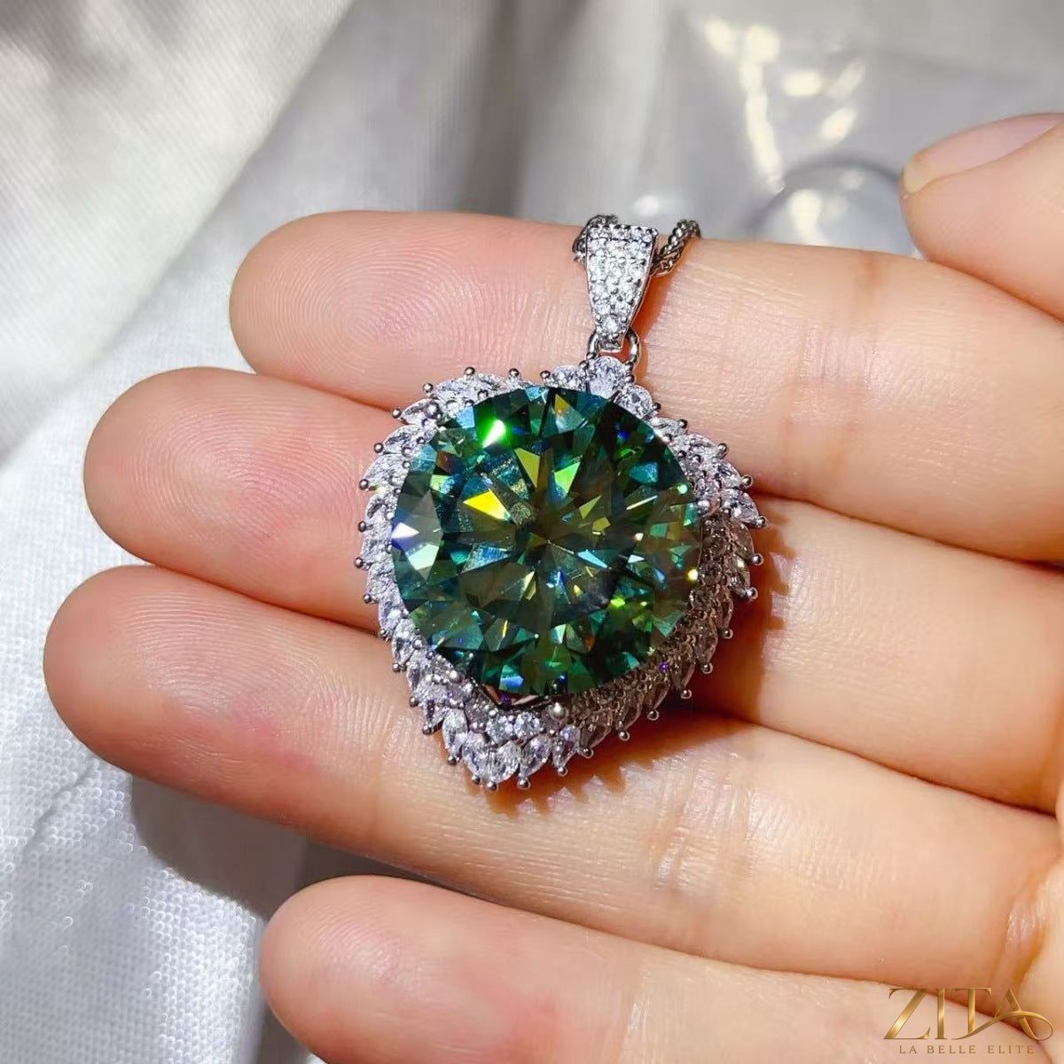 Sterling silver pendant necklace with 20 carat moissanite gemstone, elegant jewelry piece, featuring a polished silver setting.