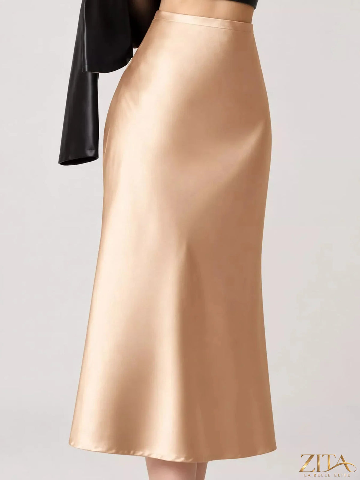 High-waisted satin midi skirt in soft sheen fabric, stylish and elegant, showcased on a neutral background.