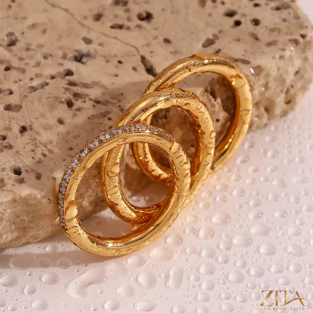 Three-piece set of stainless steel zircon rings by Zita La Belle Elite, featuring shiny silver bands with sparkling zircon stones.