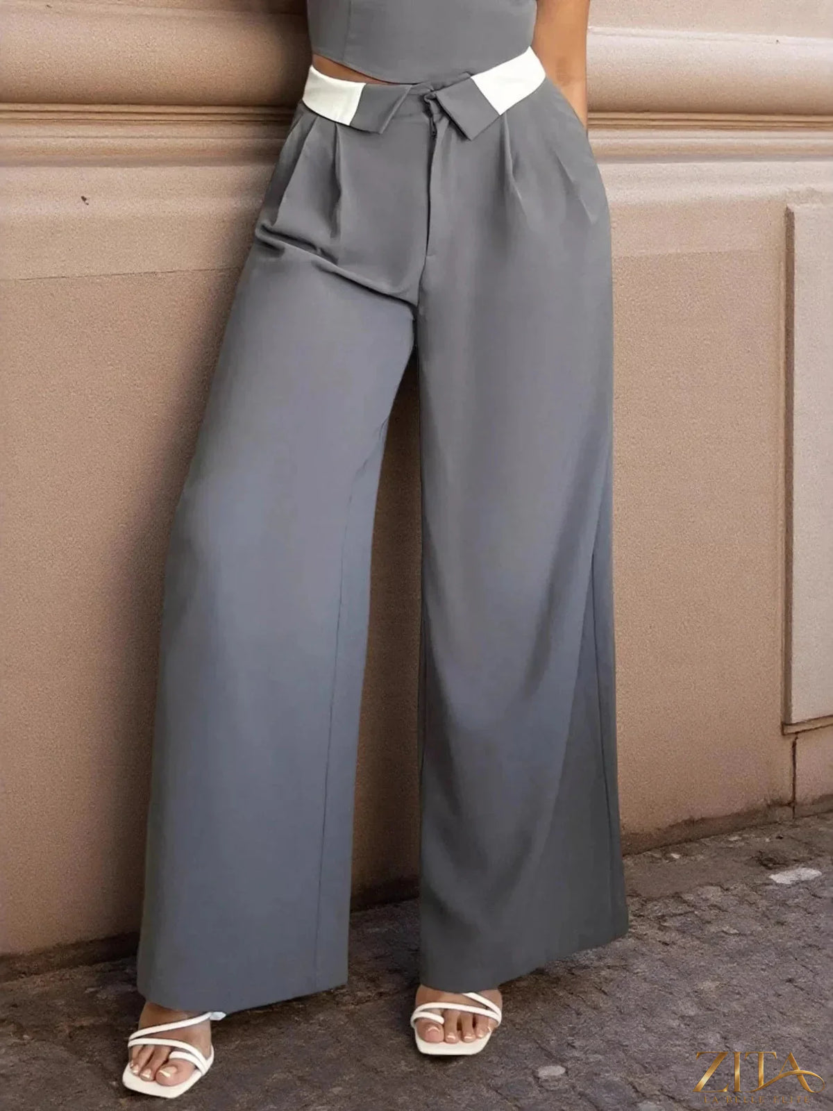 Zita La Belle Elite wide leg pants in black fabric, featuring a high waist and flowing wide-leg design.