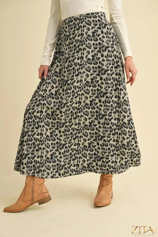 Aemi+Co leopard print midi skirt featuring a flowing silhouette and stylish design, perfect for trendy fashion looks.