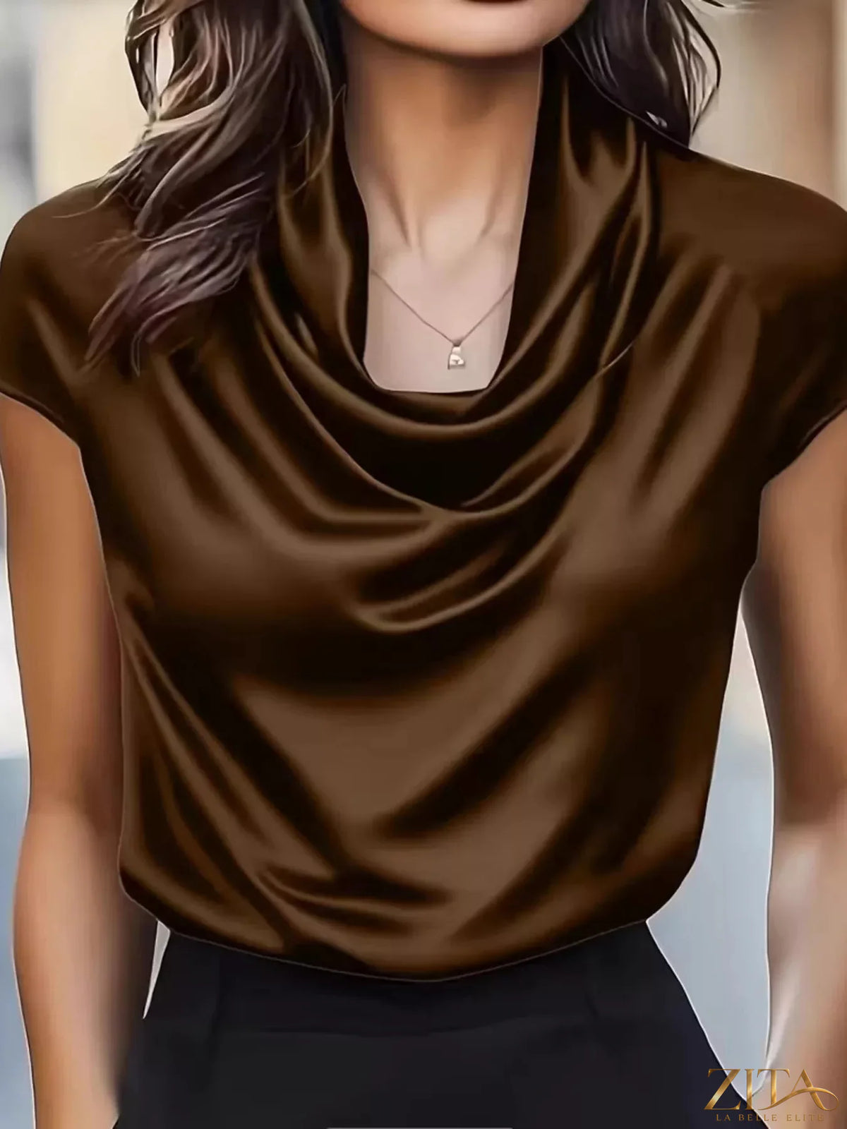 Zita La Belle Elite satin cowl neck blouse displayed on a hanger with smooth fabric and elegant drape.