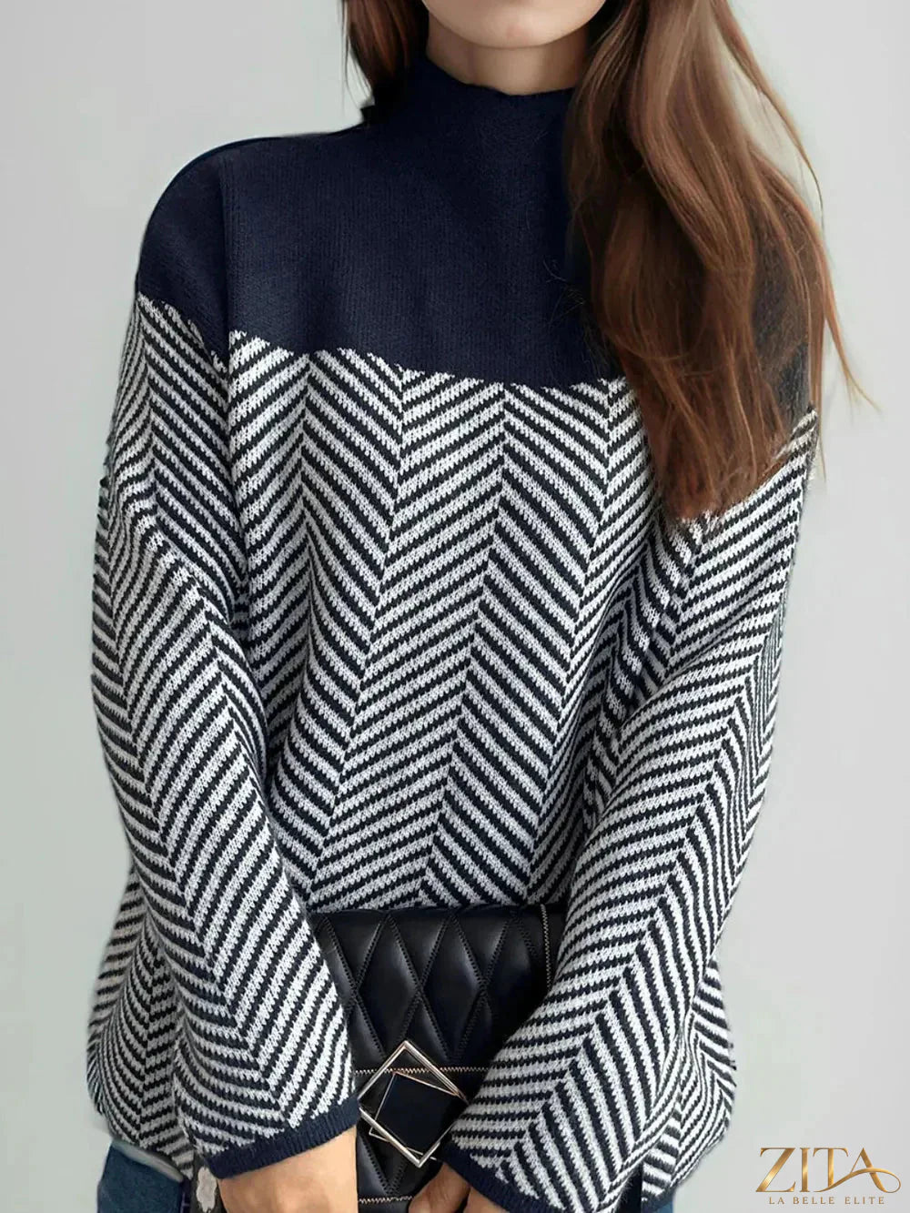 Contrast turtleneck long sleeve sweater by Trendsi, featuring a stylish black and white color block design on a cozy knit fabric.