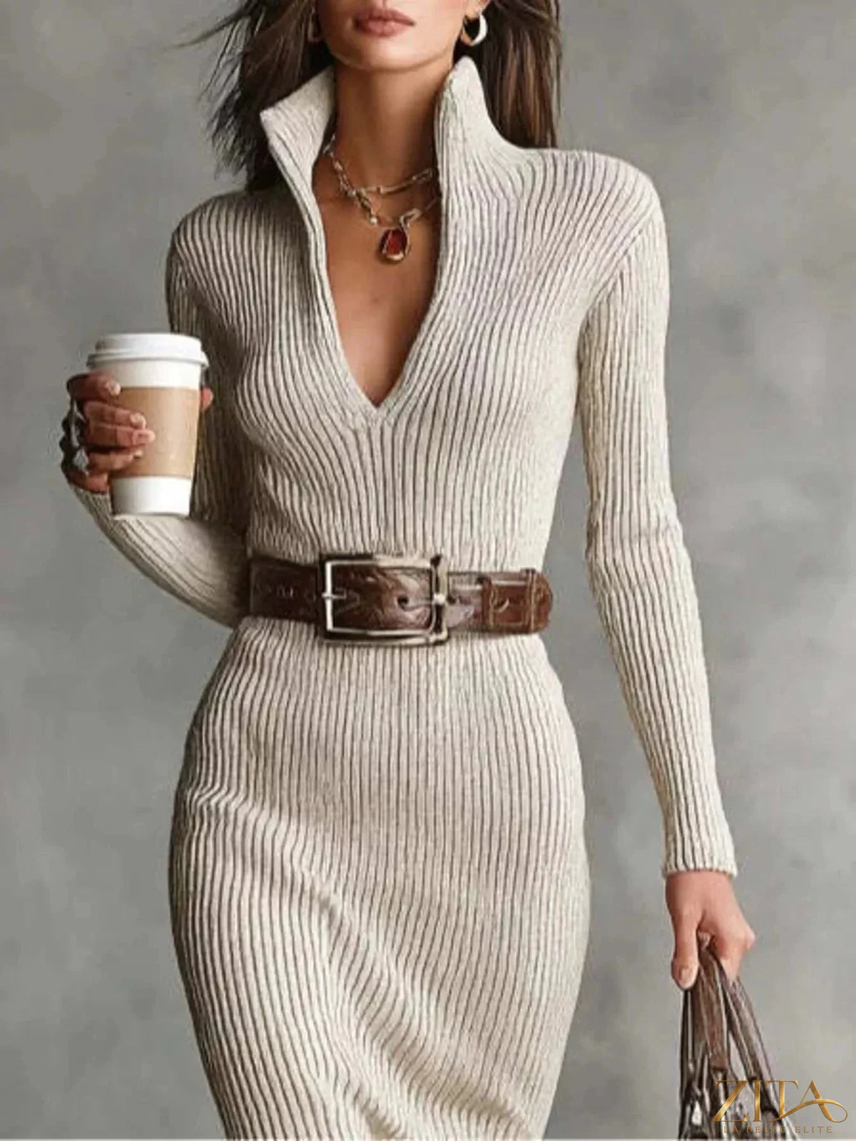 Zita La Belle Elite ribbed knit V-neck sweater dress in beige, featuring long sleeves and a fitted silhouette.