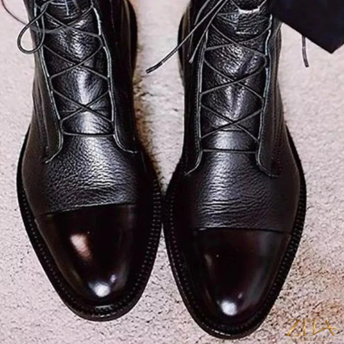 Black lace-up leather boots by Trendsi featuring a sturdy sole and classic ankle-high design.