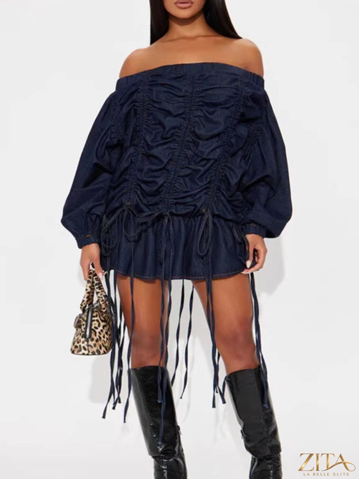 Off-shoulder ruched denim dress from Trendsi featuring a fitted bodice and casual style, shown on a model.