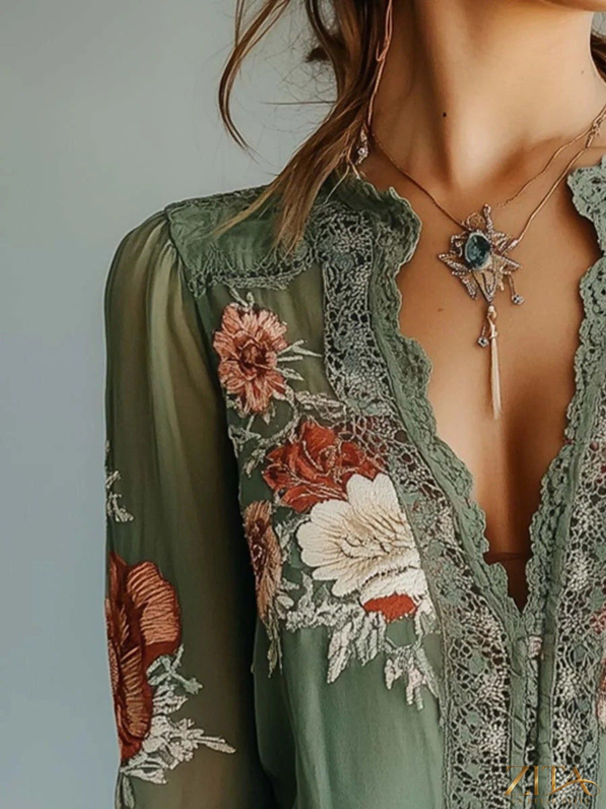 Zita La Belle Elite floral blouse with lace detail, featuring a feminine design and lightweight fabric, front view.