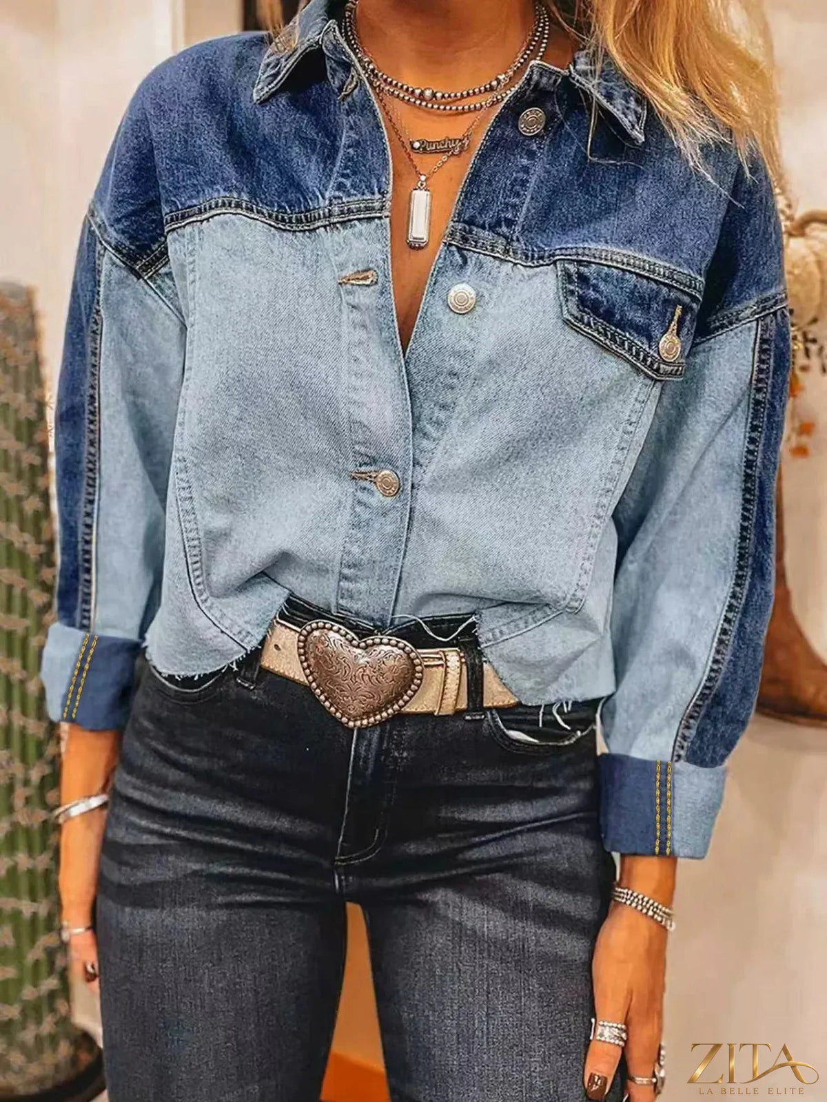 Two-tone raw hem denim jacket from Trendsi featuring a classic design with distressed detailing and a casual fit.