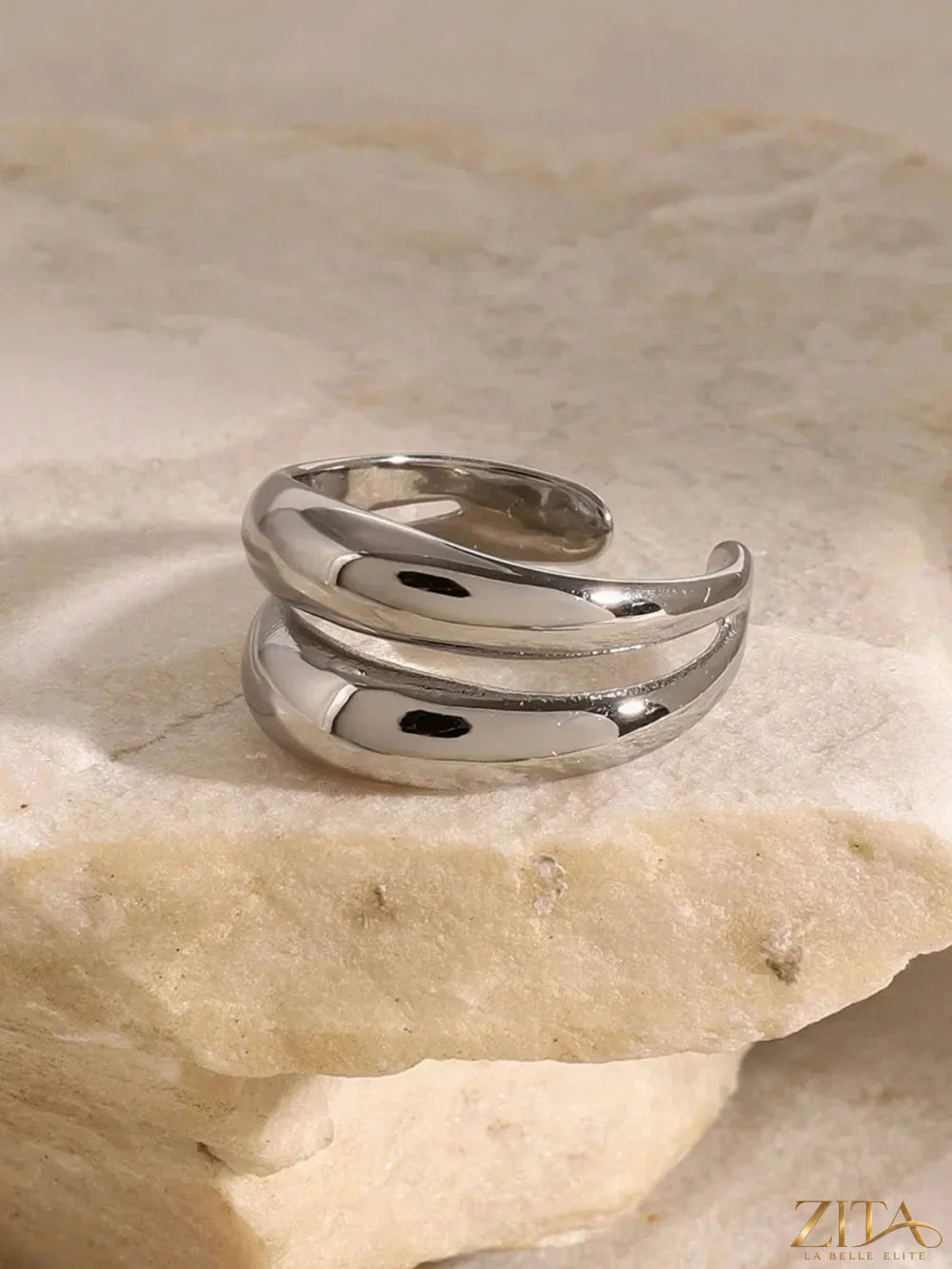 Stainless steel double-layered ring by Zita La Belle Elite showing two sleek, interconnected bands with a polished finish.