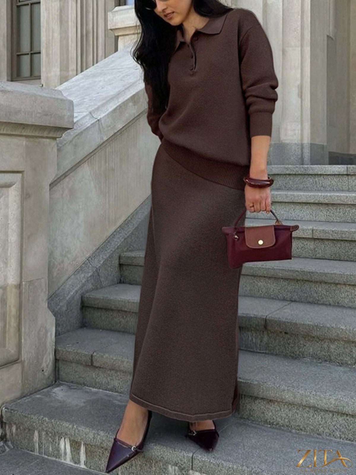 Zita La Belle Elite knit set featuring a polo collar top with matching pants or skirt, displayed on a hanger against a neutral background.