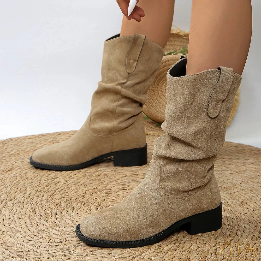 Western cowboy boots with pleated pull-on design featuring a classic western style and stitching, by Trendsi.