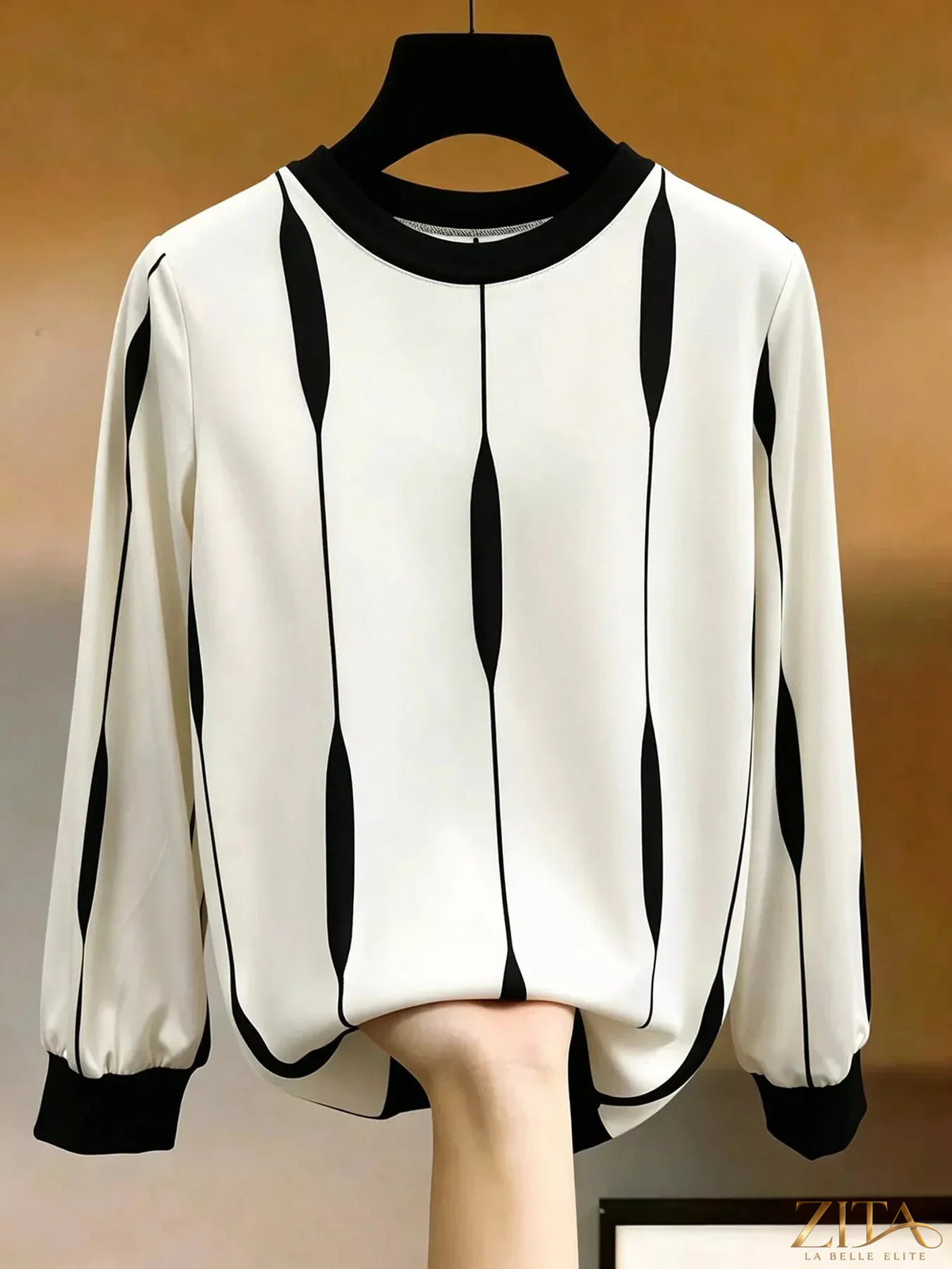 Zita La Belle Elite contrast vertical stripe long sleeve blouse with buttoned cuffs and a relaxed fit, shown on a hanger.