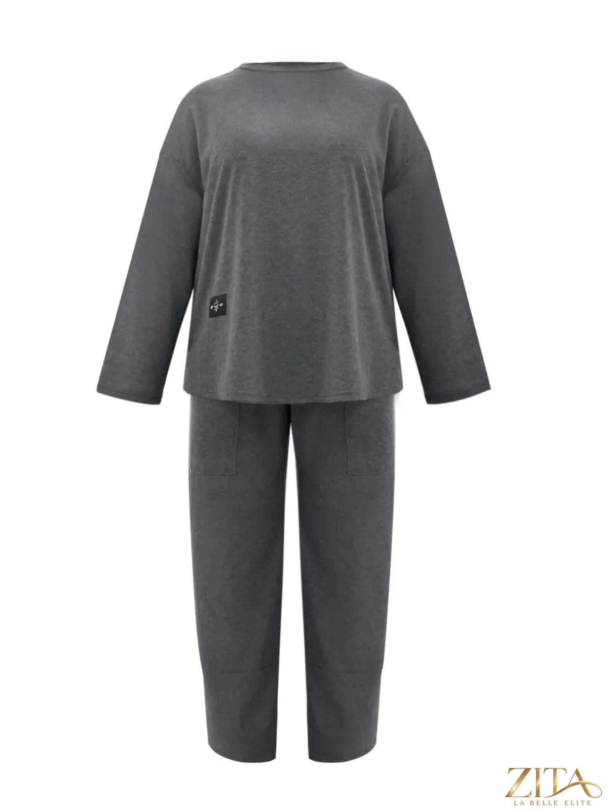 Plus size casual loose fit top and pants two-piece set by Trendsi, shown in a relaxed fit with soft fabric and stylish design.