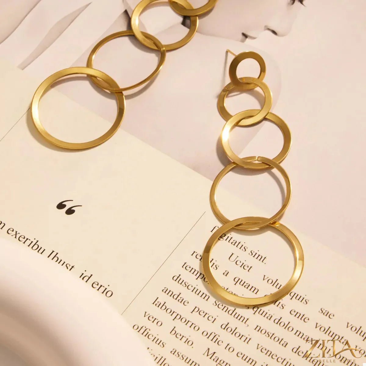18K gold-plated titanium steel round earrings by Zita La Belle Elite, showcasing shiny, smooth circular jewelry with a polished finish.