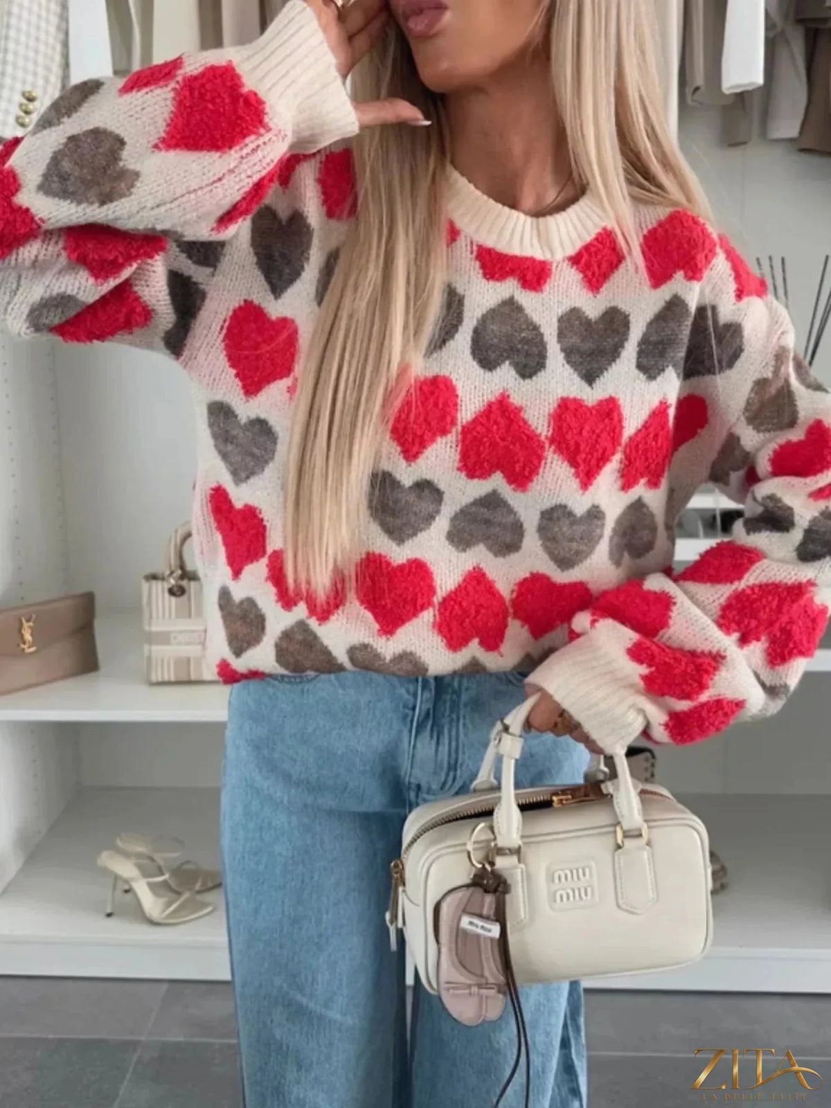 Zita La Belle Elite heart-patterned round neck sweater featuring a cozy knit design with red and pink hearts on a soft fabric.