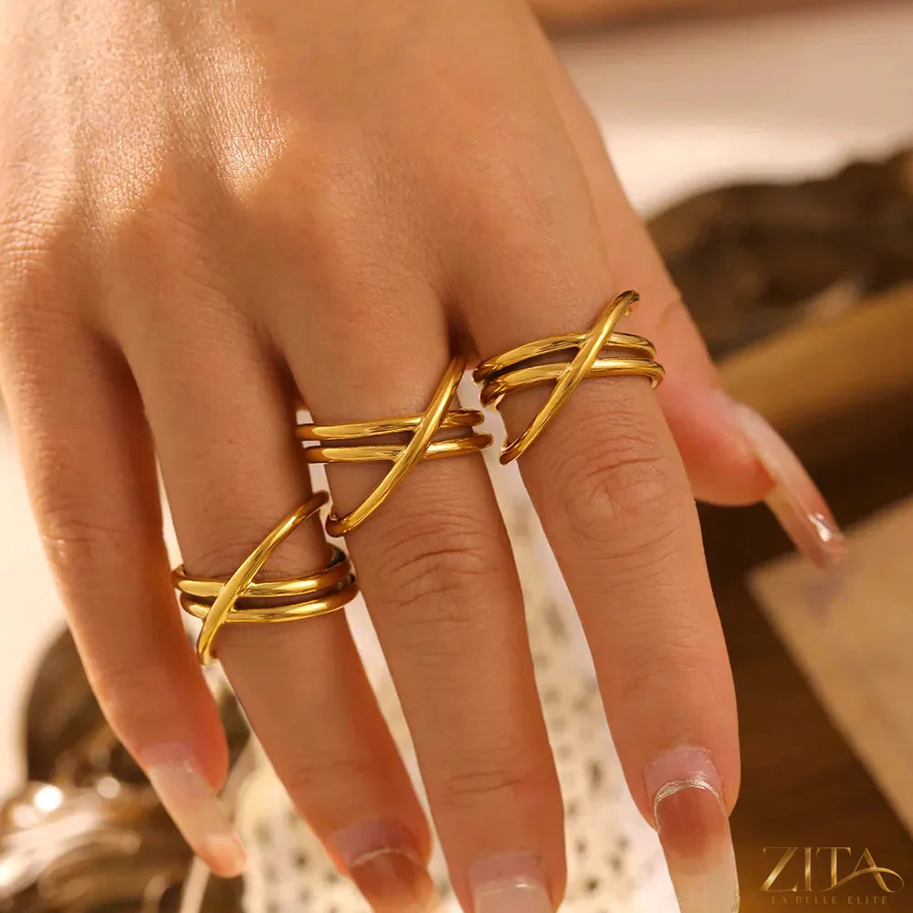 18K gold-plated crisscross ring by Zita La Belle Elite, showcasing a stylish intersecting band design on a white background.