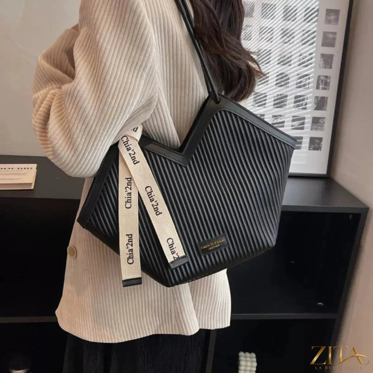 Leather textured shoulder bag by Zita La Belle Elite with a sleek design and top handle, showcasing detailed craftsmanship.