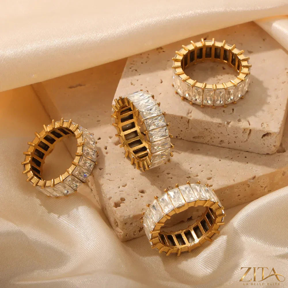 Titanium steel ring with inlaid zircon stones from Zita La Belle Elite, showcasing a sleek band with sparkling accents.