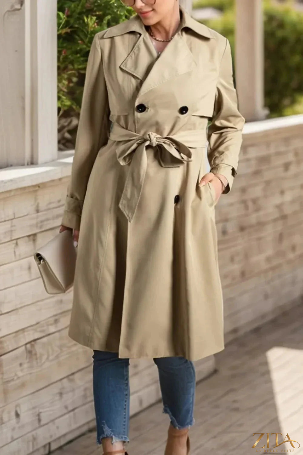Zita La Belle Elite trench coat with collared neck, buttoned waist, and long sleeves, featuring a stylish, tailored design.