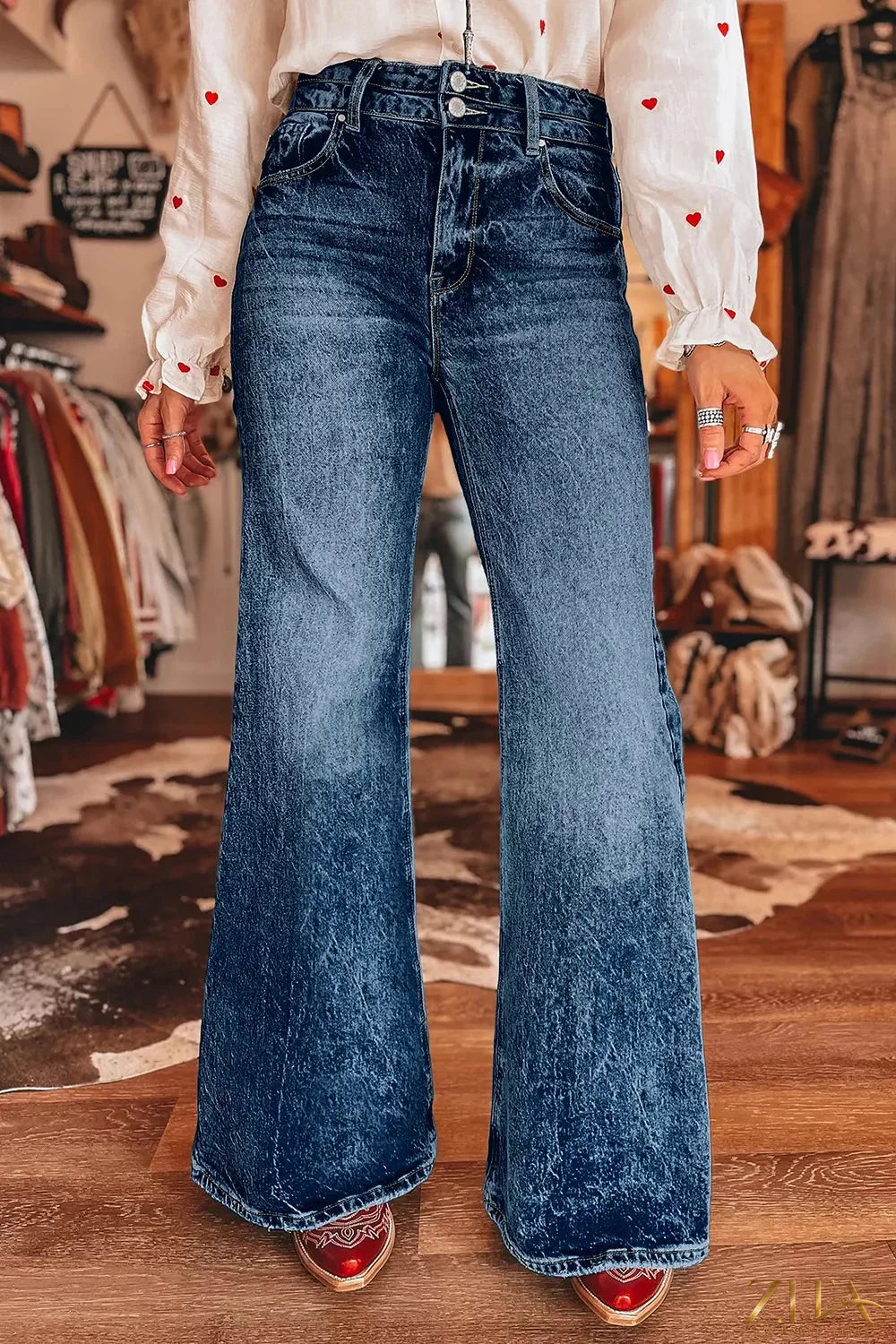 Zita La Belle Elite acid wash flare jeans with pocket details and a high-waisted fit, showcasing distressed denim and fashionable style.