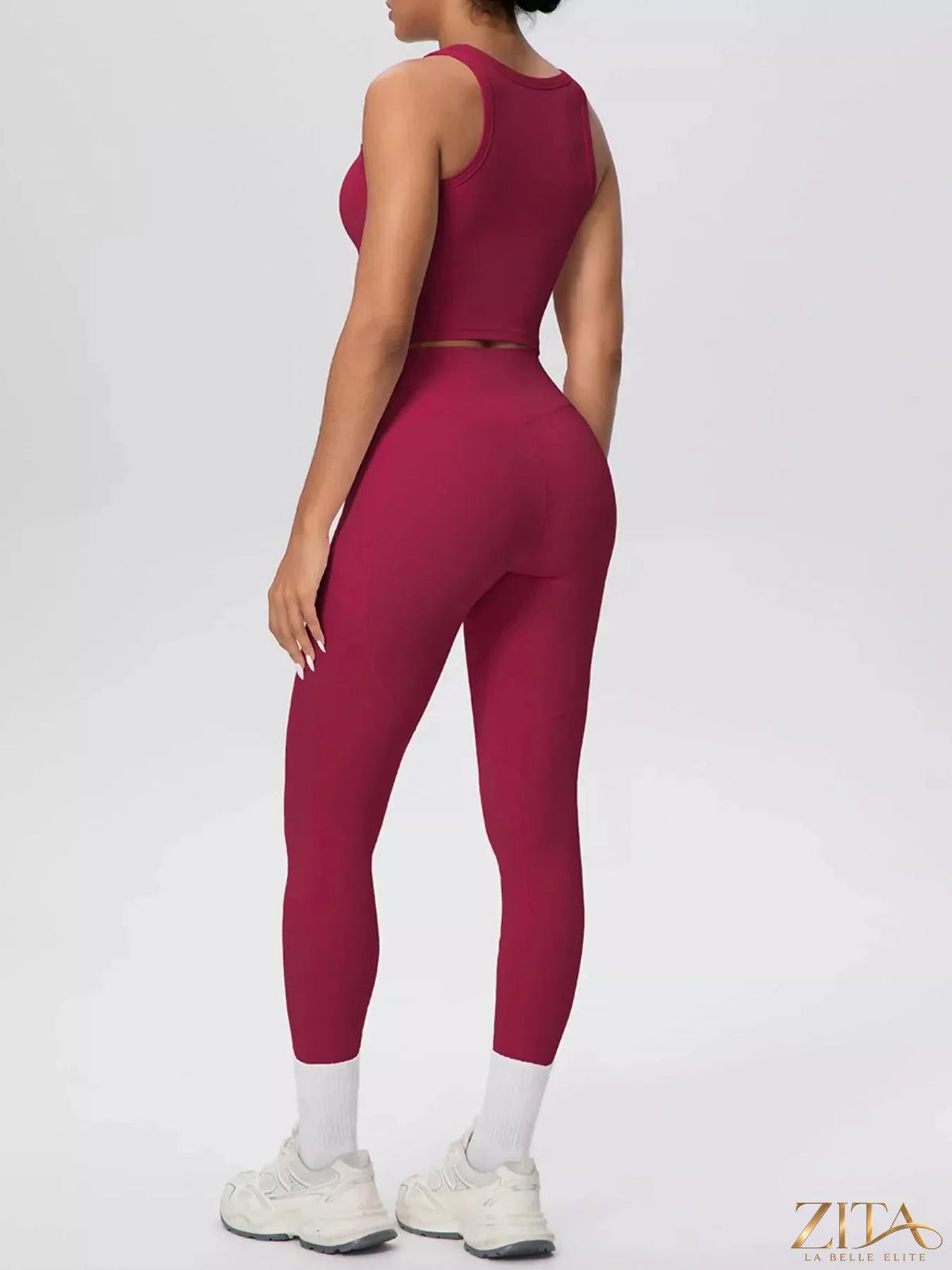 Zita La Belle Elite scoop neck tank top and high-waisted leggings active set, black fabric, close-up of the stylish workout outfit.
