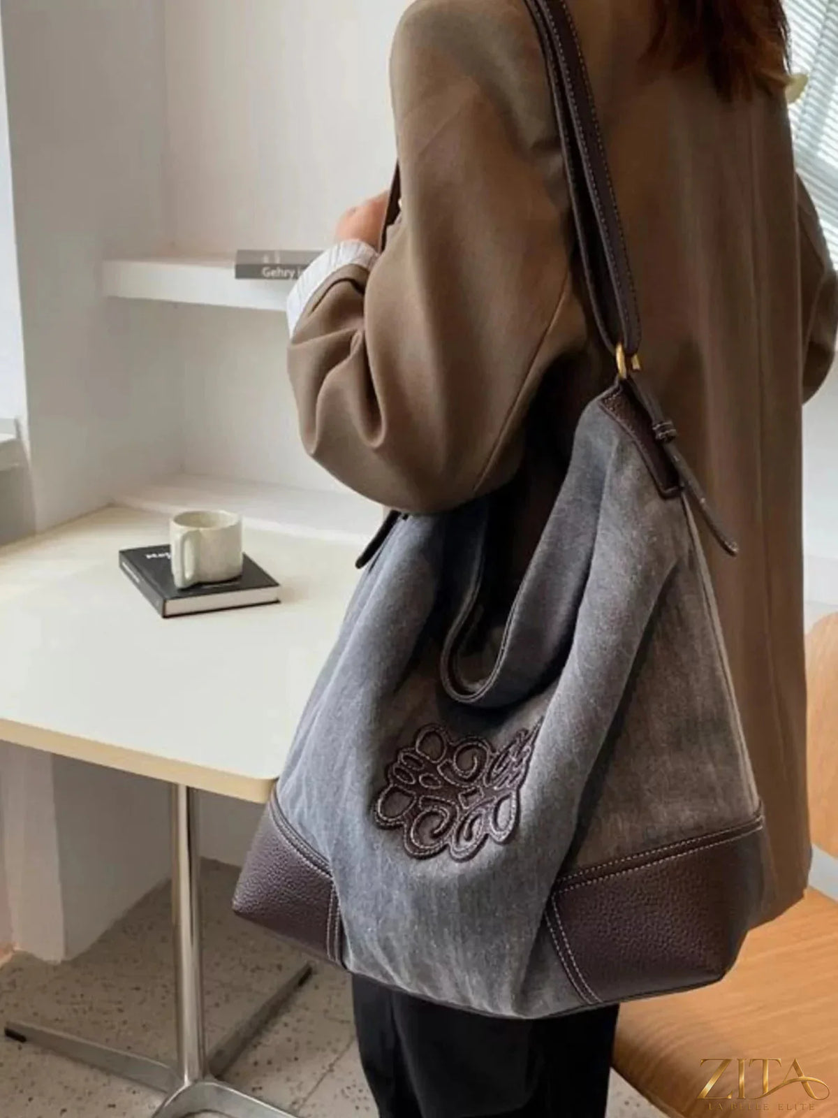 Embroidered canvas tote bag by Zita La Belle Elite with colorful floral embroidery and sturdy handles for everyday use.