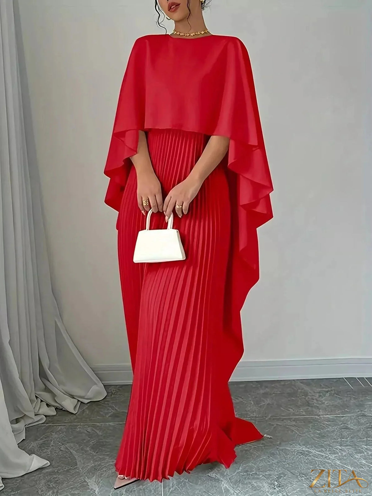 Elegant black cape pleated maxi dress from Trendsi with flowing fabric and floor-length design, perfect for formal occasions.