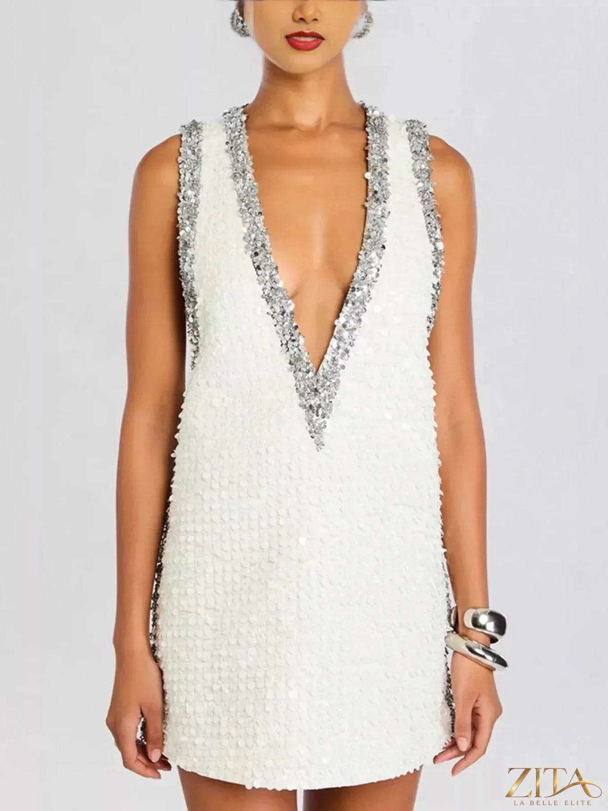 Sequin embellished sleeveless mini dress by Zita La Belle Elite, featuring a shimmering design and fitted silhouette.