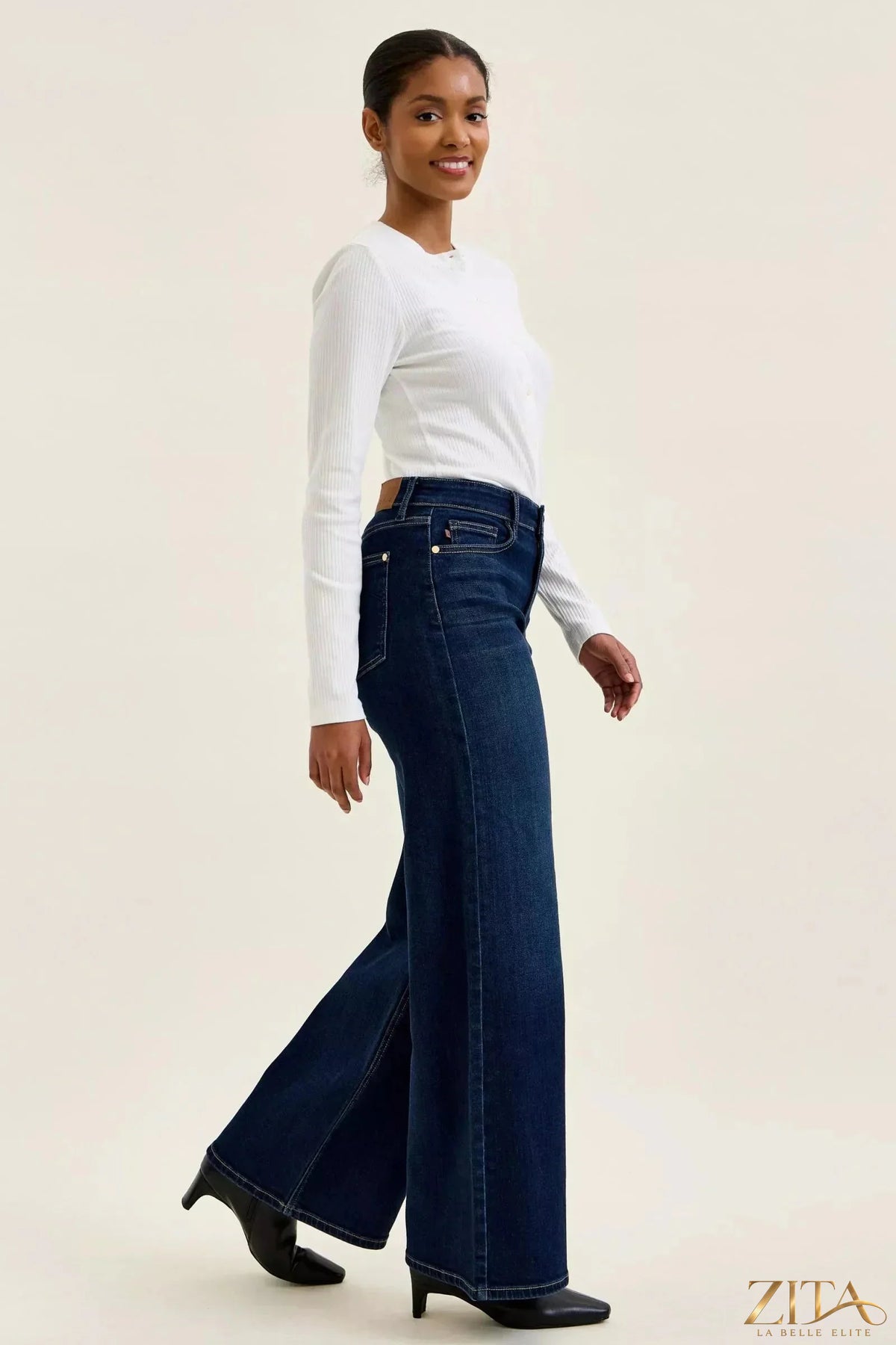 Zita La Belle Elite Judy Blue high-waisted dark wash wide-leg jeans displayed on a hanger with detailed stitching and fit.