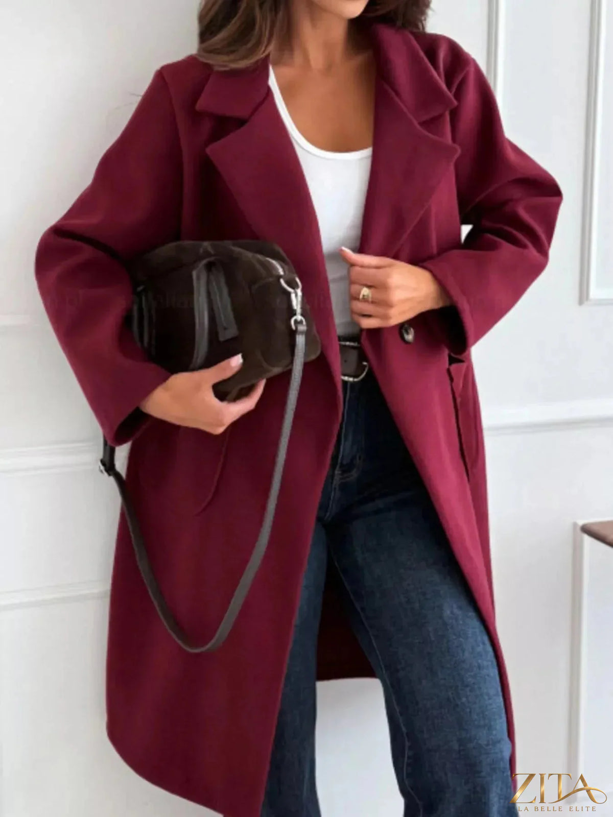 Zita La Belle Elite long-sleeve single-breasted trench coat in classic beige, displayed on a hanger with a neutral background.