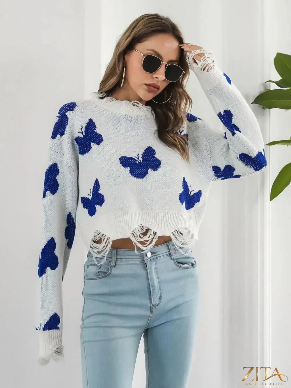 Distressed butterfly design cropped sweater by Zita La Belle Elite featuring a casual, fashionable look with a distressed finish.