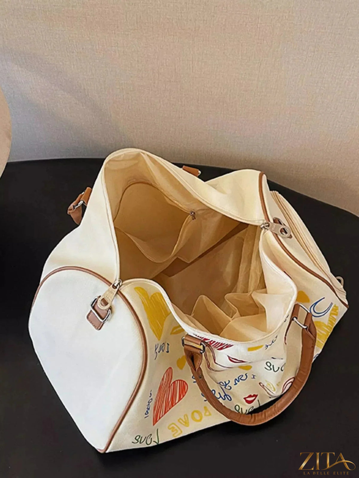Zita La Belle Elite printed duffel bag with adjustable strap, featuring colorful patterns and sturdy handles for travel or gym use.