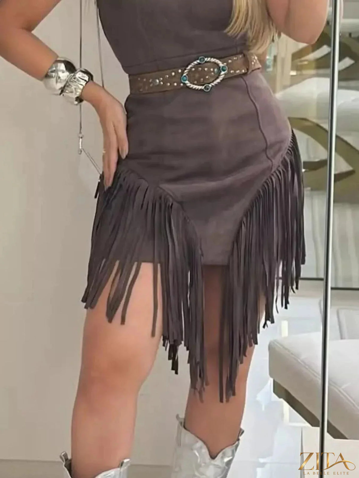 Zita La Belle Elite sleeveless fringed mini dress with flowing fringe details and a fitted silhouette on a model.