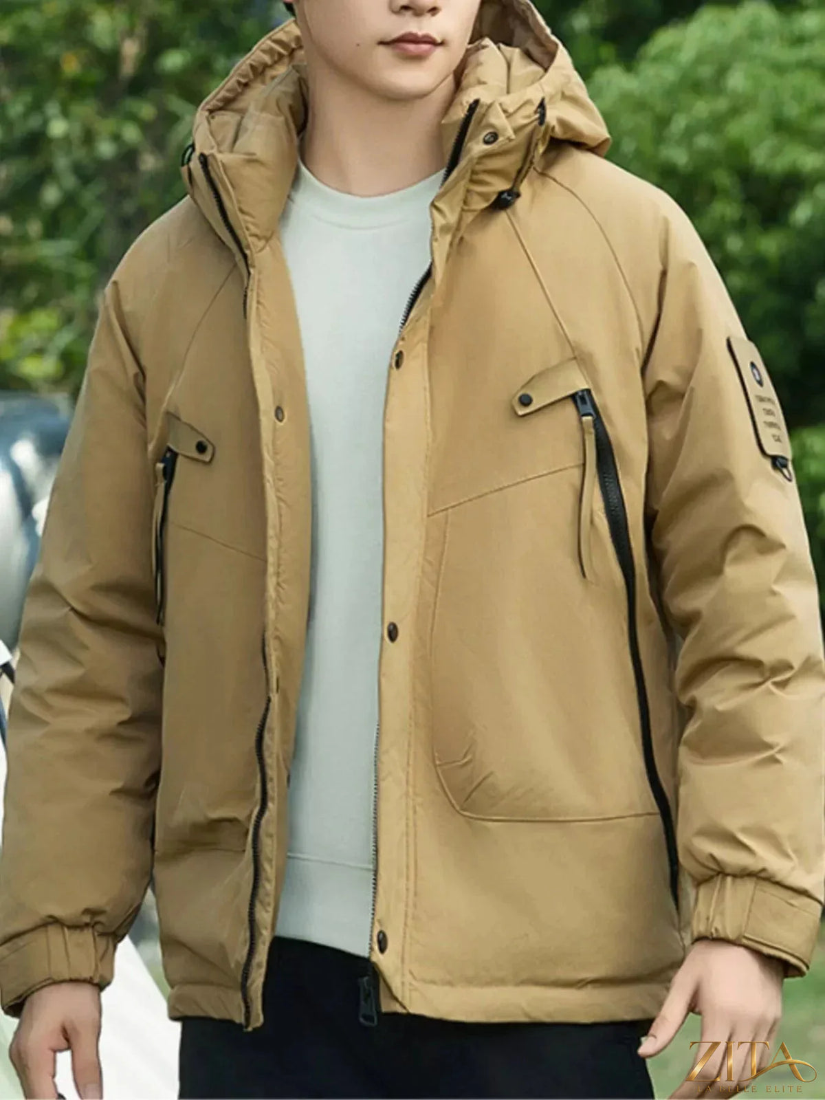 Plus size men's hooded snap-down jacket by Zita La Belle Elite, featuring a front zipper, hood, and snap button details.