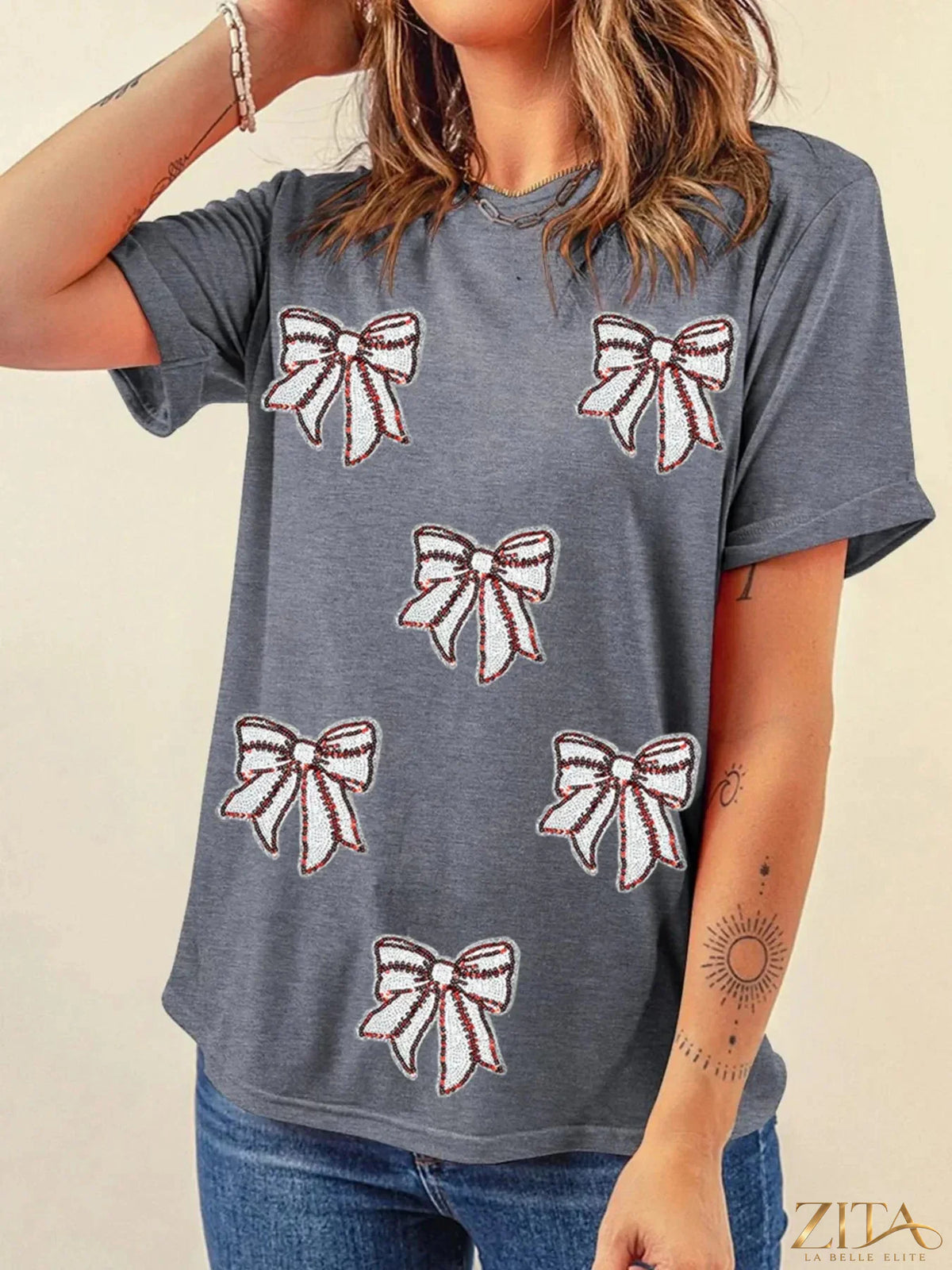 Sequin bow short sleeve T-shirt by Trendsi featuring a sparkly bow detail on a casual short sleeve tee.