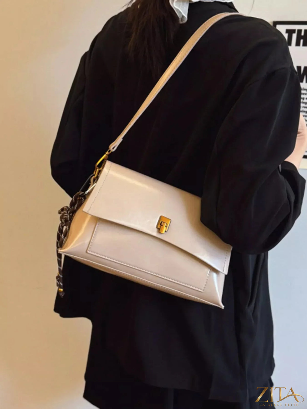 Leather flap shoulder bag by Trendsi featuring a sleek design, adjustable strap, and top flap closure for versatile style.