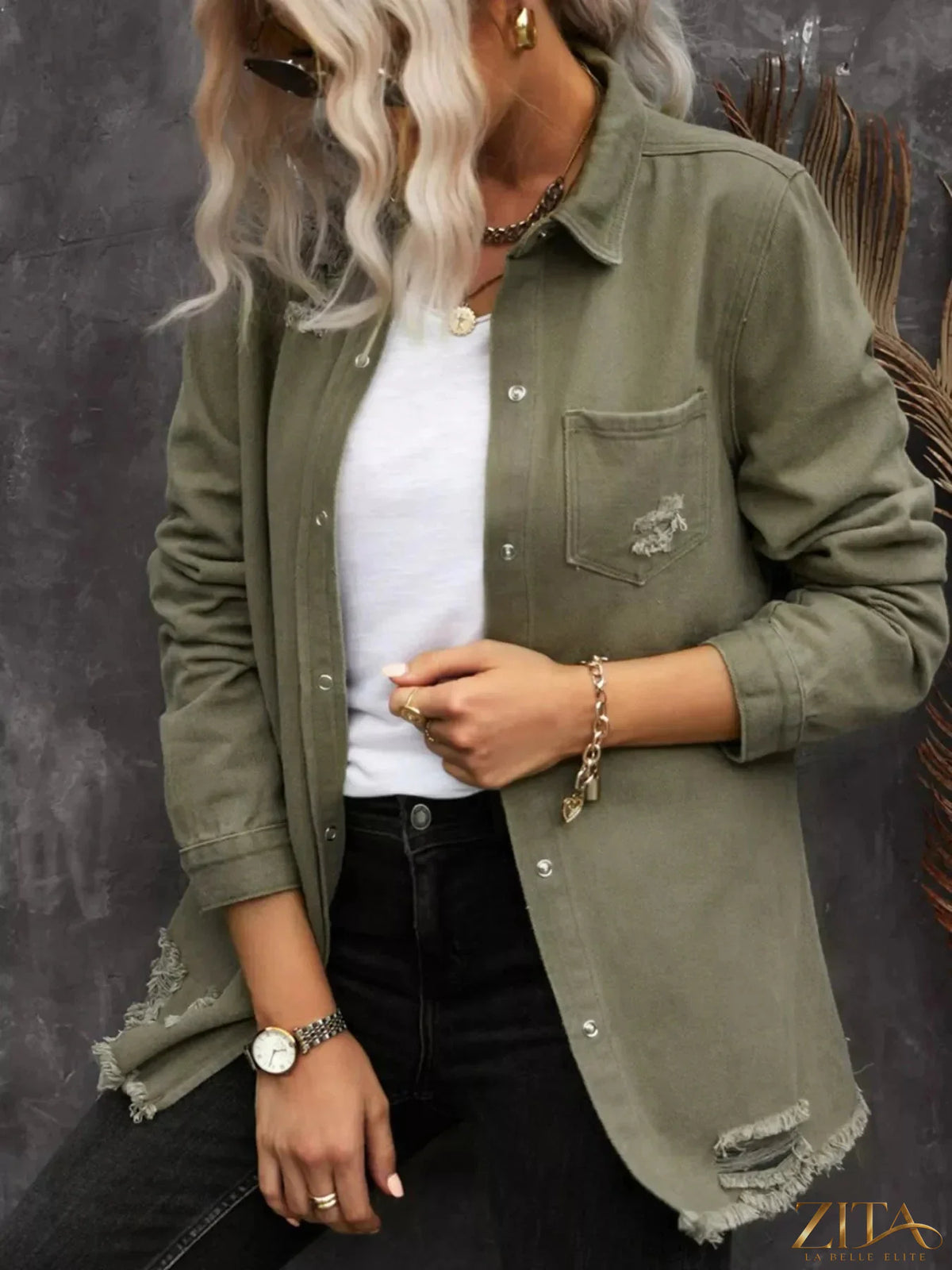 Zita La Belle Elite raw hem distressed denim shirt jacket with frayed edges and casual fit, displayed on a hanger.