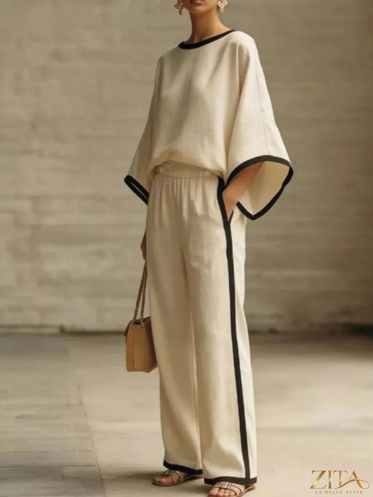 Plus size contrast trim top and wide-leg pants set by Zita La Belle Elite, featuring a stylish coordinated outfit with bold detailing.