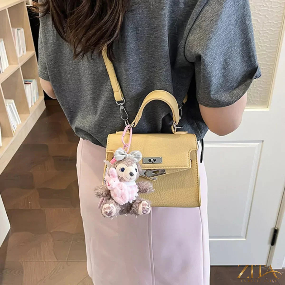 Trendsi PU leather handbag with top handle, gold-tone hardware, and spacious interior, stylish and versatile for everyday use.