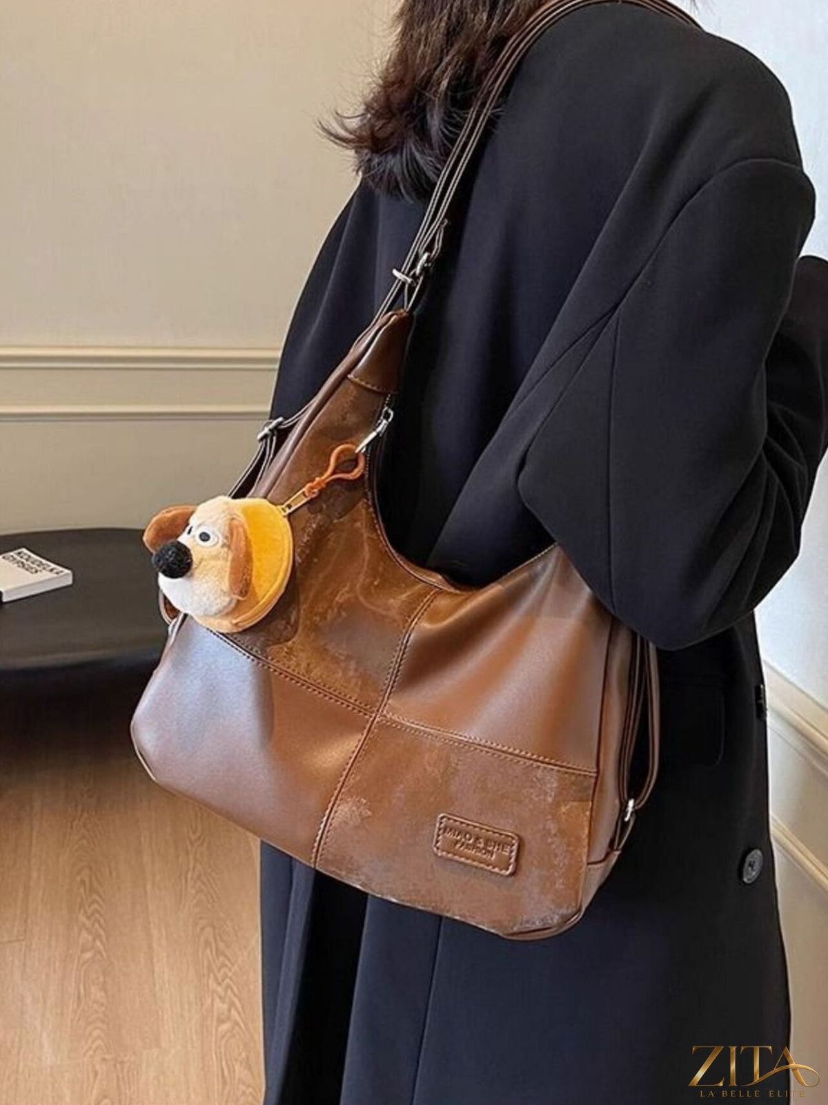 Vintage style hobo shoulder bag by Zita La Belle Elite featuring brown leather, slouchy design, and adjustable shoulder strap.