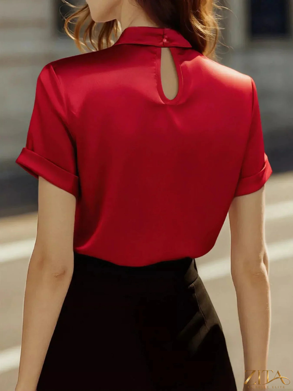 Zita La Belle Elite satin keyhole short sleeve blouse with elegant neckline and smooth fabric, displayed on a mannequin.