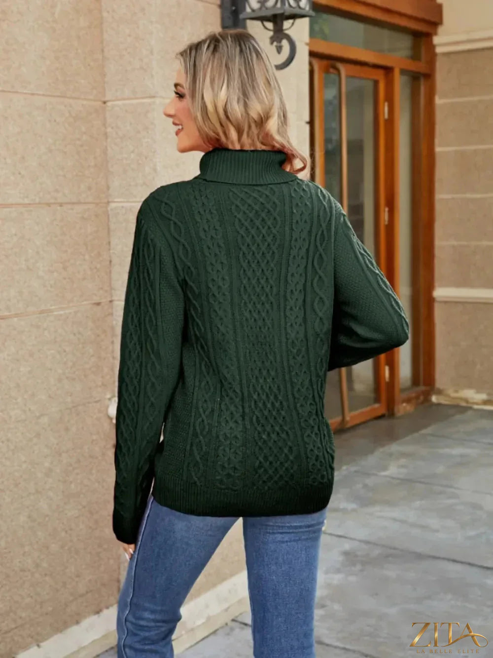 Zita La Belle Elite cable-knit mock neck sweater in cozy cream with textured knit pattern and ribbed cuffs.