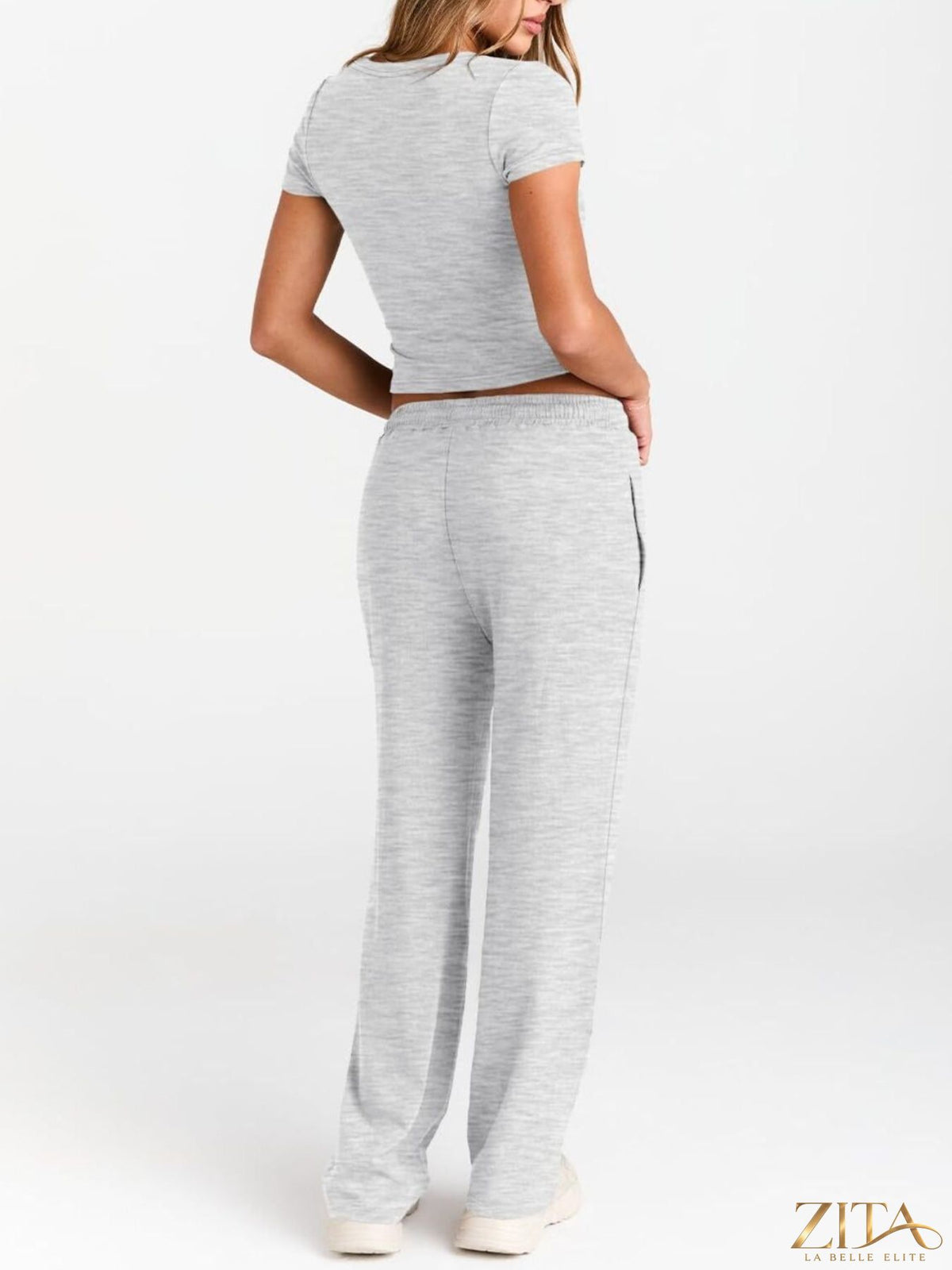 Trendsi round neck short sleeve tee and matching pants set, soft fabric, casual style, displayed in neutral color on a flat lay.