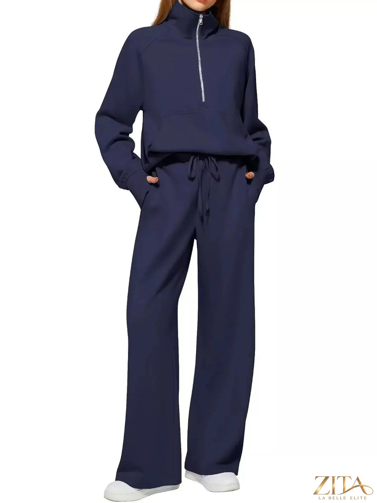 Zita La Belle Elite half-zip sweatshirt and wide-leg pants set, in neutral fabric, laid flat for display.