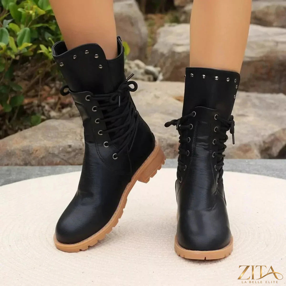 Black studded lace-up boots by Trendsi featuring metal accents and rugged soles, displayed on a white background.