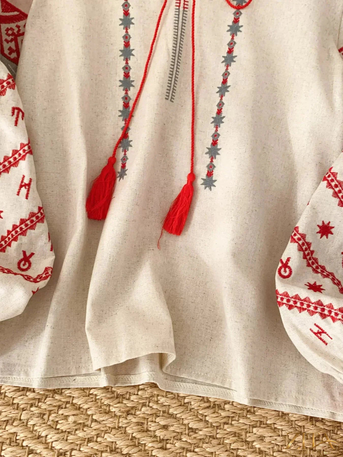 Zita La Belle Elite embroidered tie neck blouse with floral details and long sleeves, displayed on a white background.